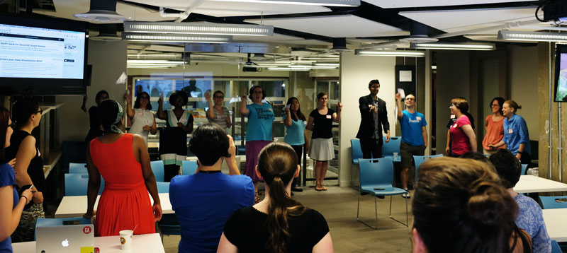 Attendees flying their paper airplanes